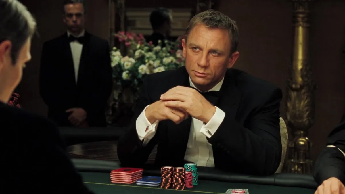 Still from Casino Royale (2006) of Daniel Craig sitting at a poker table